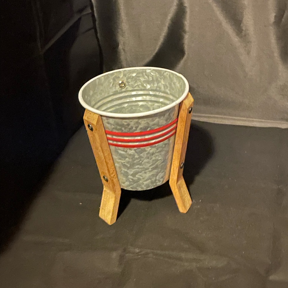 Galvanized striped planter on wooden stand